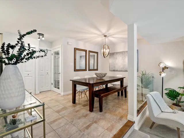 Dining area with baseboards and a chandelier