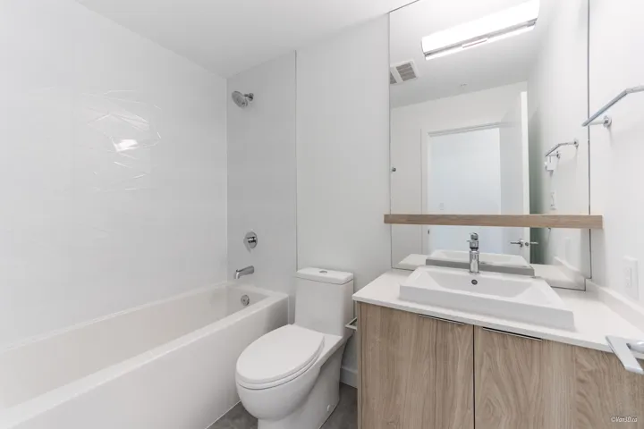Bathroom featuring vanity and shower / bath combination