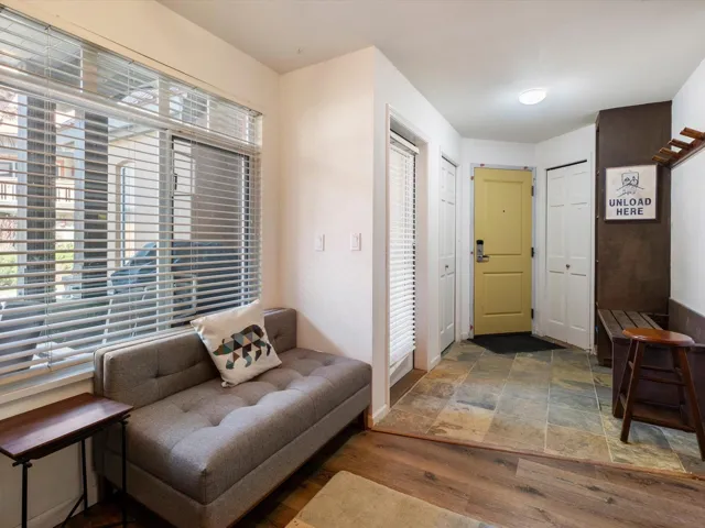 Entrance foyer featuring baseboards and wood finished floors