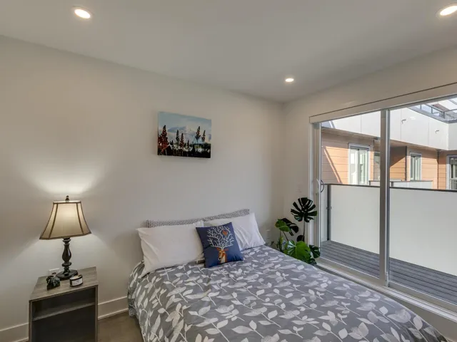 Bedroom featuring wood finished floors, baseboards, and recessed lighting