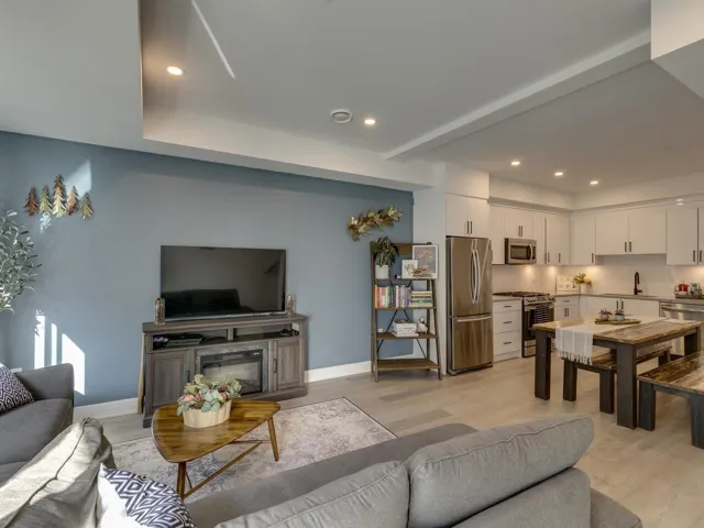 Living area featuring light wood-type flooring and recessed lighting