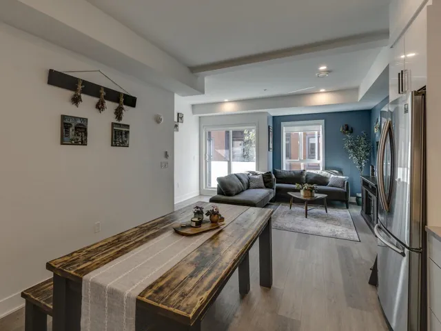 Interior space with baseboards, wood finished floors, and recessed lighting