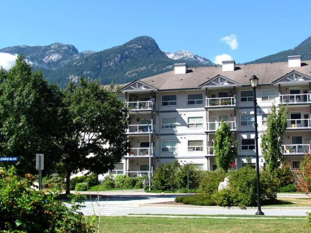 View of apartment building / complex featuring a mountain view