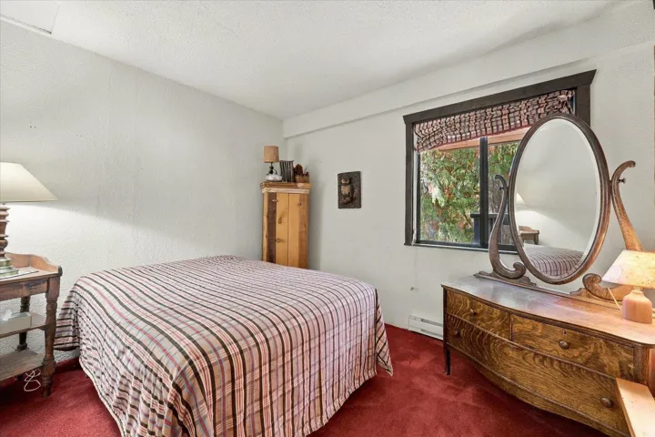 White textured walls and red carpeting