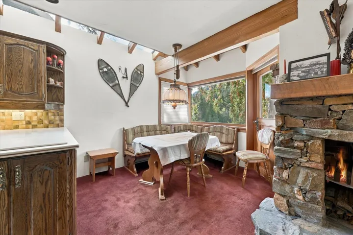 Stone fireplace with a wood-finish mantle