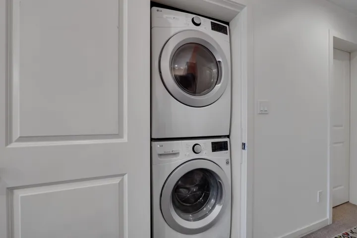 Washroom with estacked washer and dryer