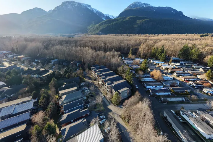 Aerial view of residential area featuring a mountain backdrop