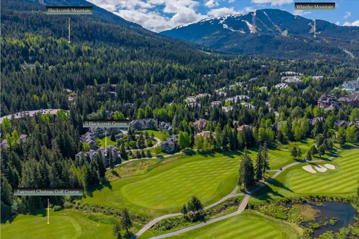 Expansive golf course frontage with surrounding mature trees, offering a mountain backdrop and neighborhood setting