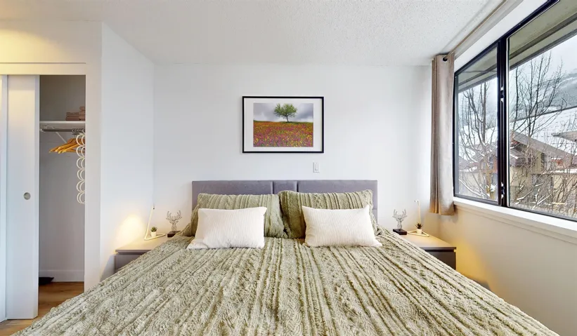 Bedroom with a closet and a textured ceiling