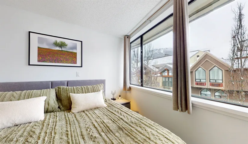 Bedroom with a textured ceiling