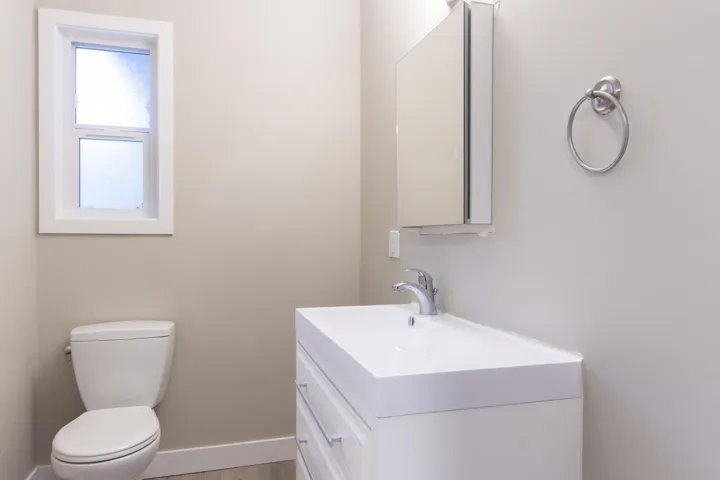 Half bath featuring vanity and light wood-style flooring