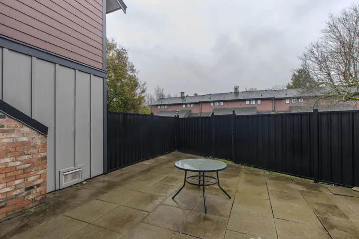 Fenced backyard with a patio area
