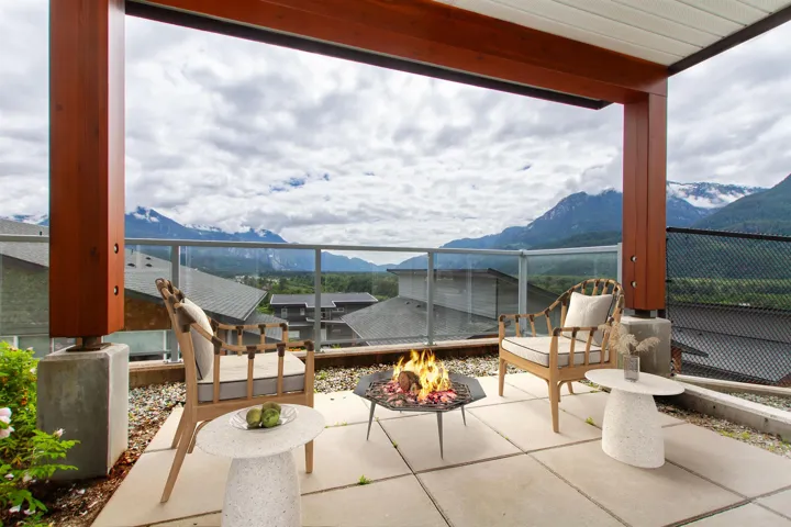 Virtual staged photo.  Walk out patio from the recreation room on the lower level.
