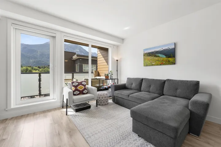 Living room featuring light wood-style floors and a mountain view