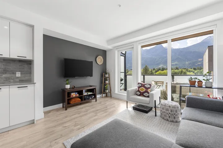 Living room with light wood-style flooring and baseboards