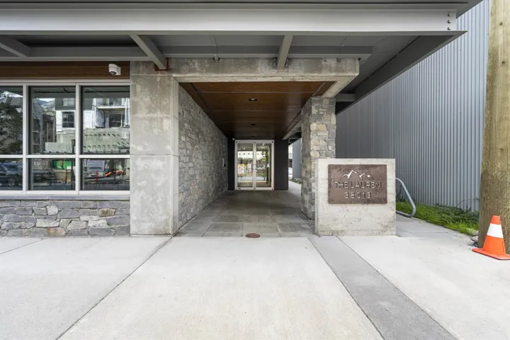 Property entrance featuring stone siding