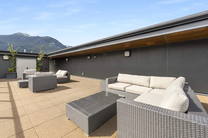 View of patio / terrace with outdoor furniture and a mountain view