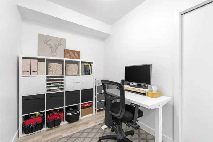 Home office featuring light wood-style flooring and baseboards