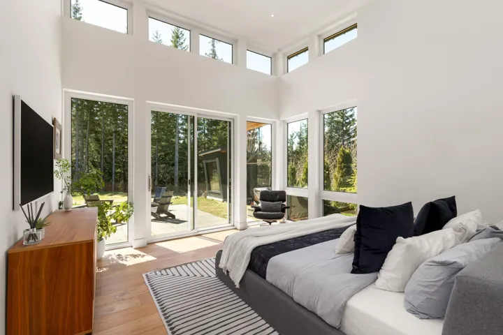 Expansive interior featuring high ceilings and wood-finish flooring