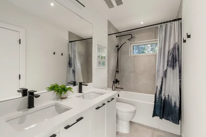 Dual vanity with integrated sinks and matte black fixtures