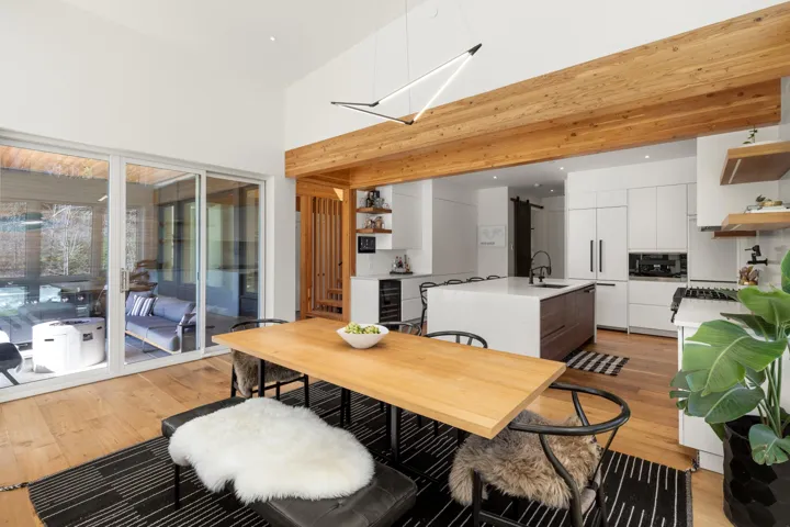 Open-concept kitchen and dining area with hardwood flooring