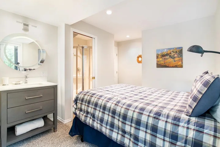 Bedroom featuring light carpet and recessed lighting