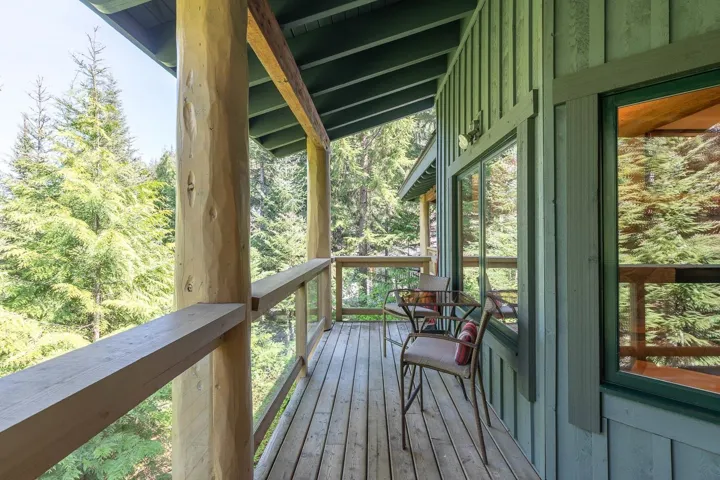 Expansive wood-plank deck featuring robust natural wood support beams and railings
