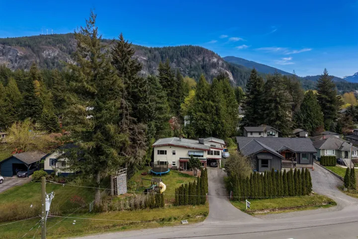 Aerial view of residential area featuring mountains