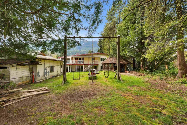 Rear view of property featuring a lawn