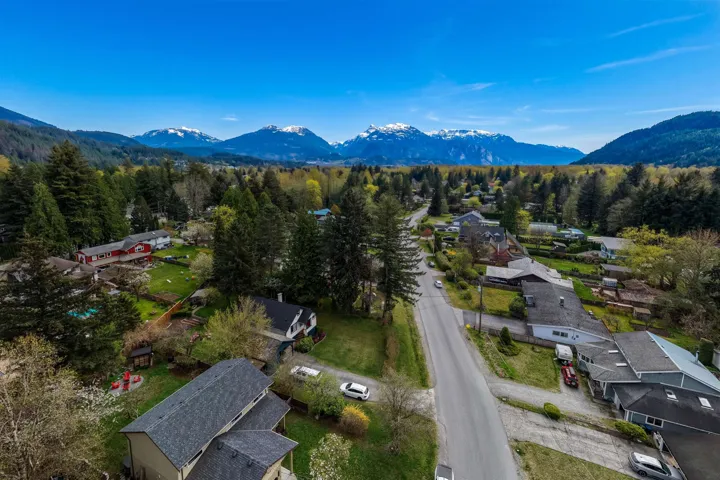Aerial view of residential area featuring a mountain backdrop