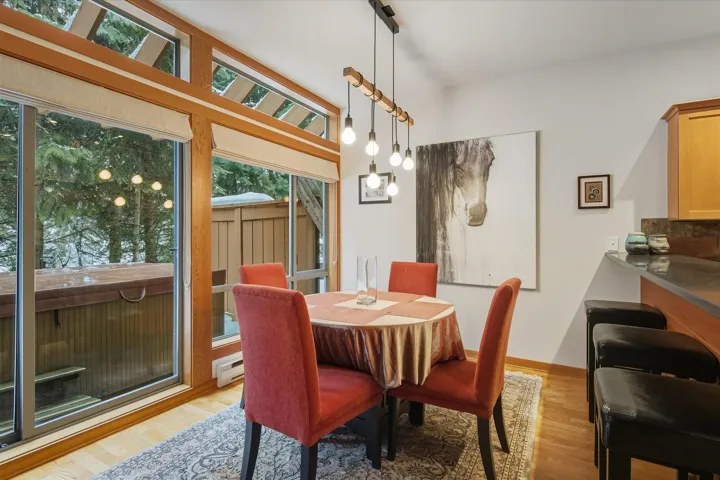 Dining area featuring light wood finished floors and baseboard heating