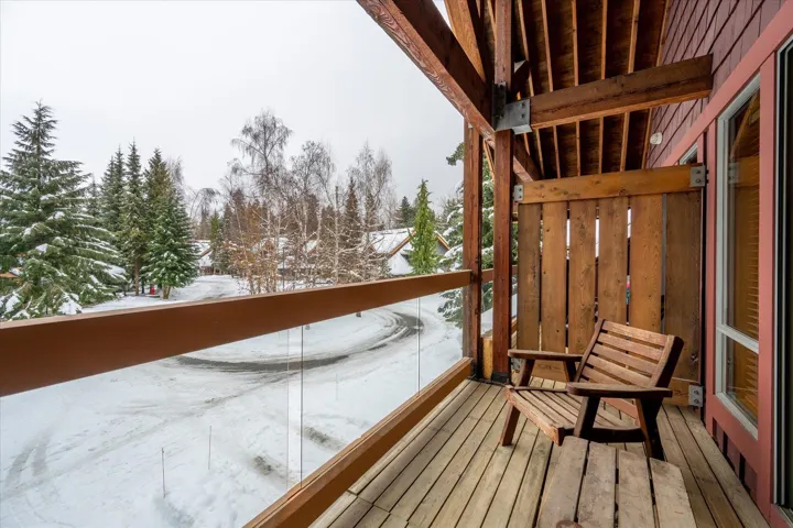 View of snow covered back of property