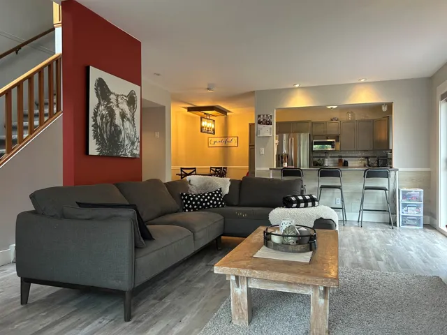 Living area with stairs and light wood-style floors