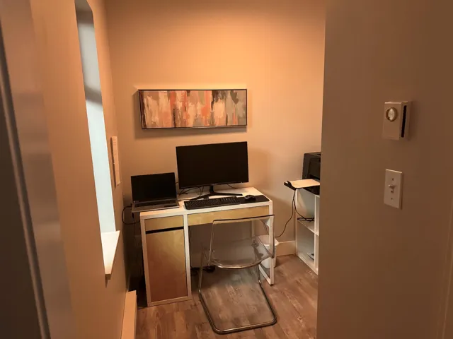 Office area with wood finished floors