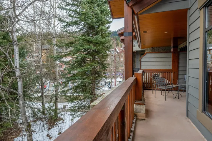 View of snow covered back of property