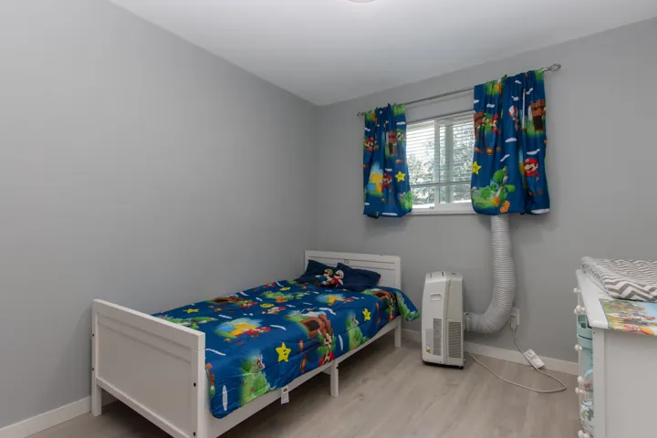 Living room with light wood finished floors, a fireplace, and recessed lighting
