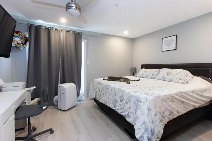 Bedroom featuring light wood-style flooring and baseboards