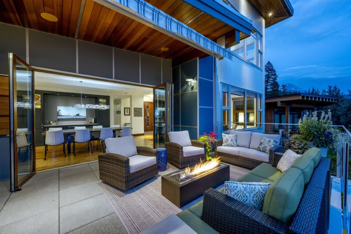 Patio terrace at dusk with an outdoor living space with a fire pit and a patio