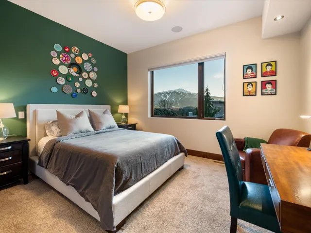 Carpeted bedroom with baseboards