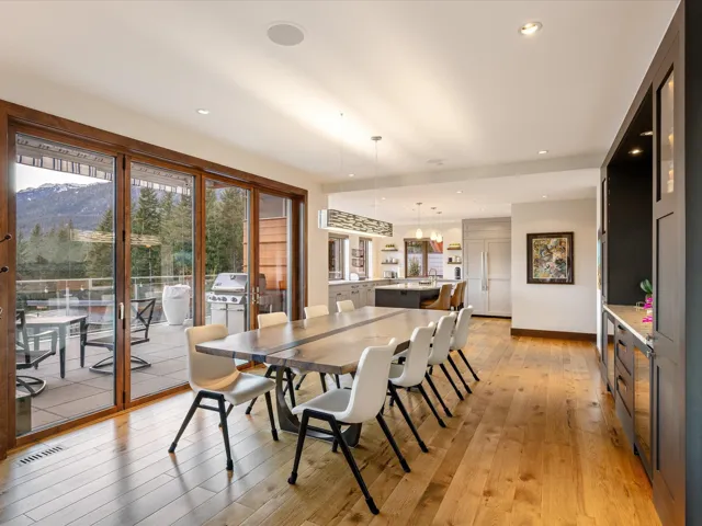Dining area featuring light wood-style floors, recessed lighting, and a chandelier