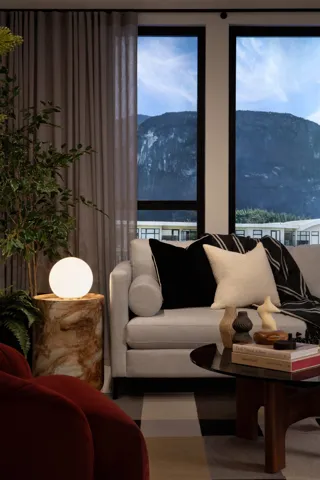 Expansive window wall with a mountain backdrop