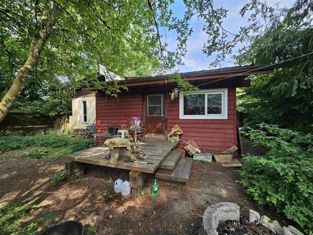 Back of property with a deck