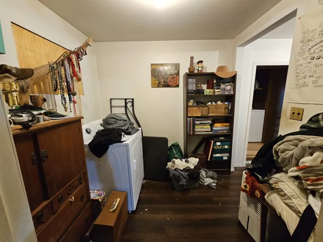 Interior space featuring washer / clothes dryer and dark wood-style flooring