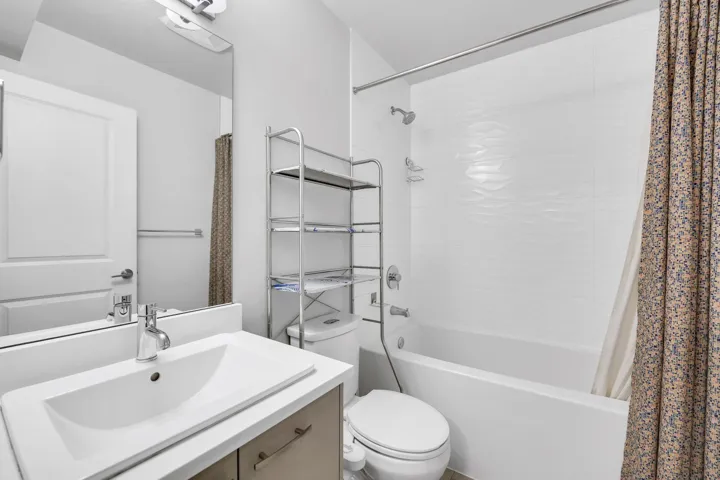 Bathroom featuring shower / bath combo and vanity