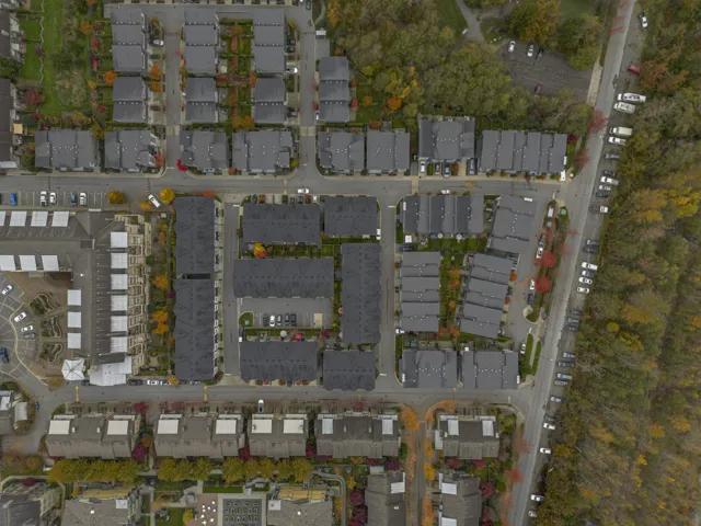 Aerial view of property's location with property parcel outlined and nearby suburban area