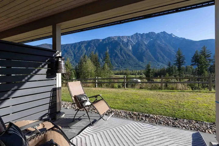 View of patio featuring a mountain view and a wooded view