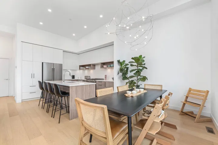 Dining space with light wood finished floors, recessed lighting, and a chandelier