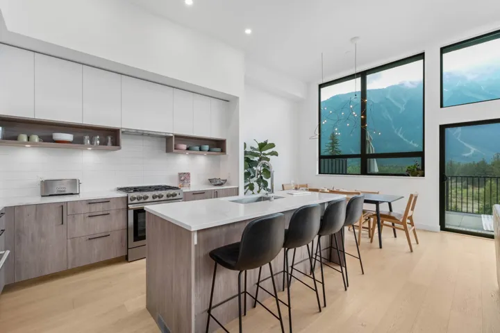 Kitchen featuring open shelves, modern cabinets, light wood-style floors, high end stove, and recessed lighting