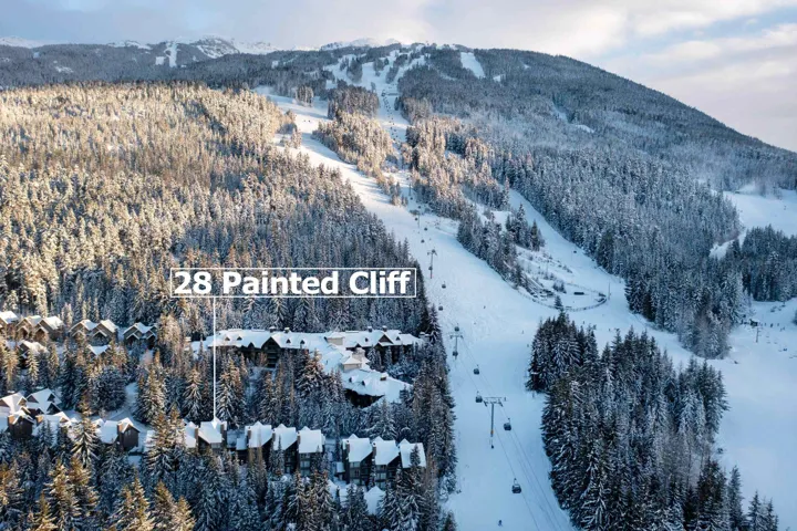Snowy aerial view featuring a mountain view