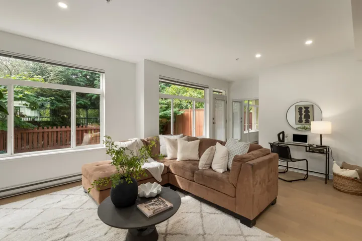 Living area featuring recessed lighting, light wood-type flooring, and baseboard heating